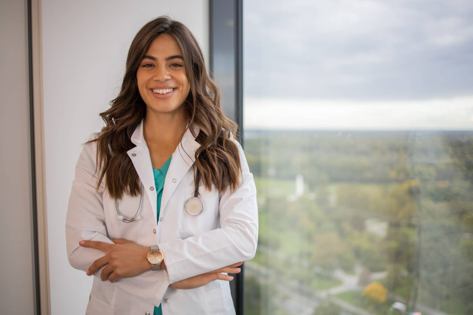 Dermatologist smiling during a patient consultation in a medical office
